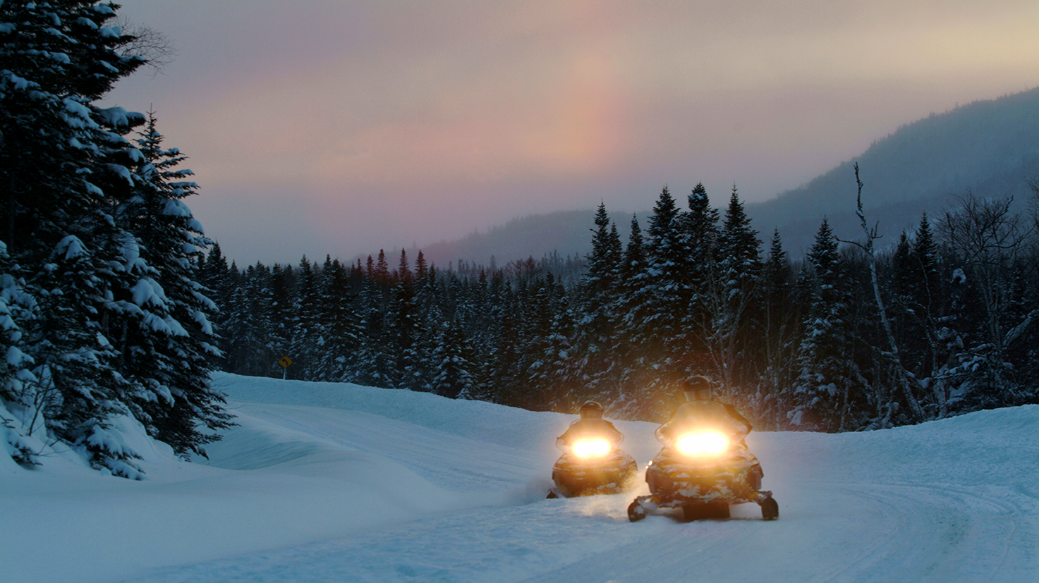 Canada snowmobile driving during winter night
